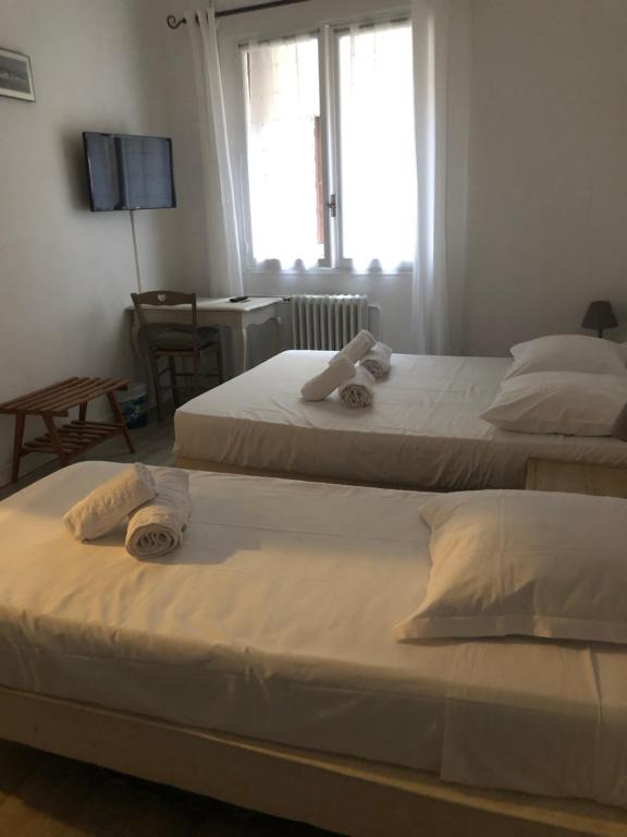 Postel nebo postele na pokoji v ubytování Hotel François 1Er
