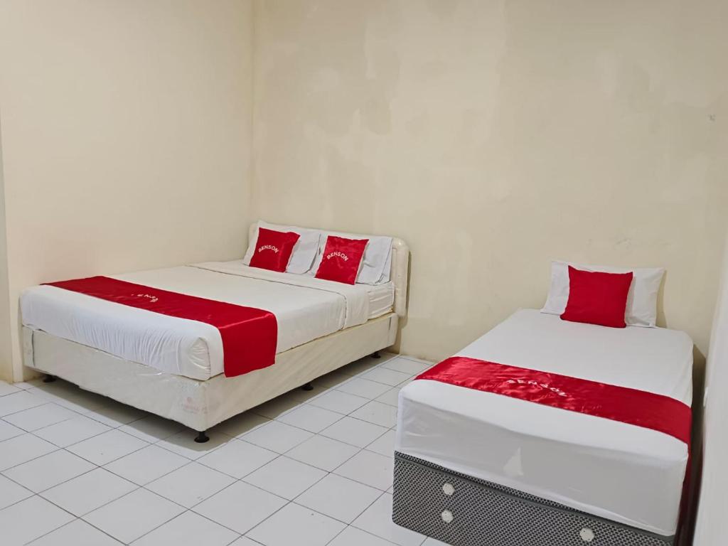 Postel nebo postele na pokoji v ubytování Hotel Benson