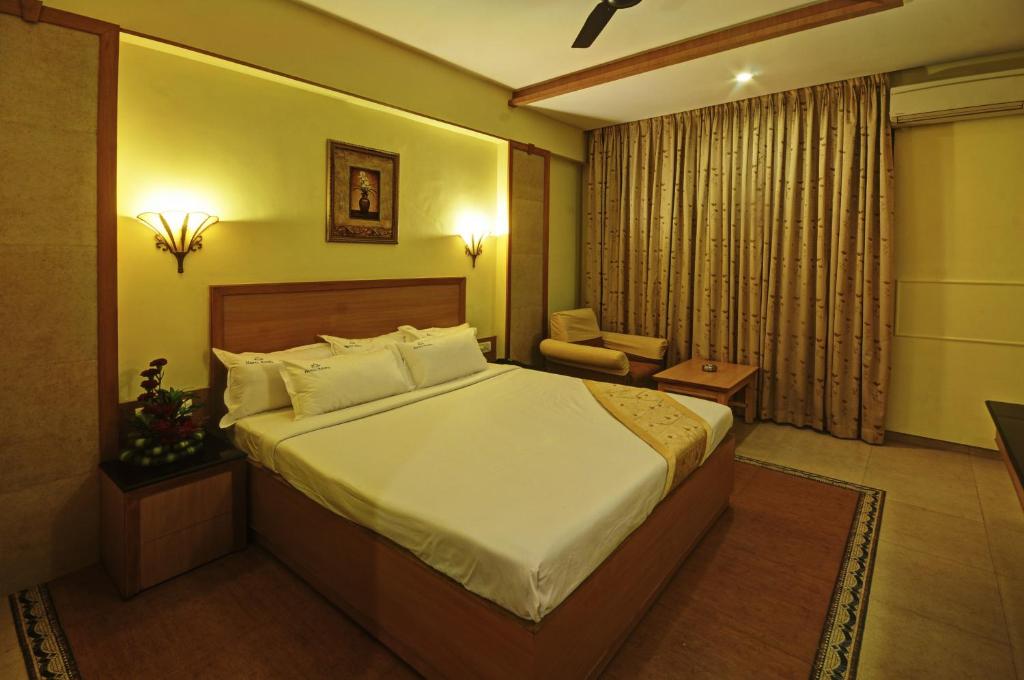Voodi või voodid majutusasutuse Hotel Roopa toas