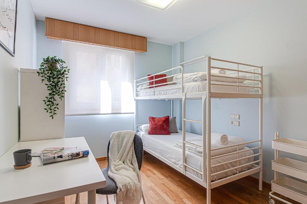 A bed or beds in a room at San Amaro Beach Apartment