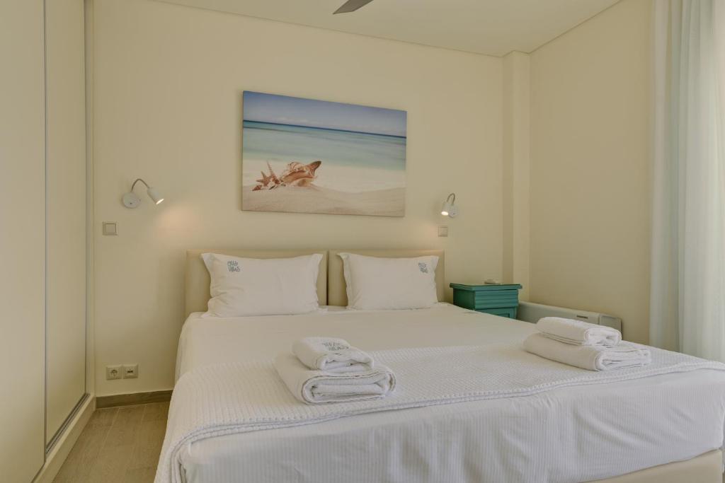 Кровать или кровати в номере Ouzo Panoramic Houses 1, with private pool