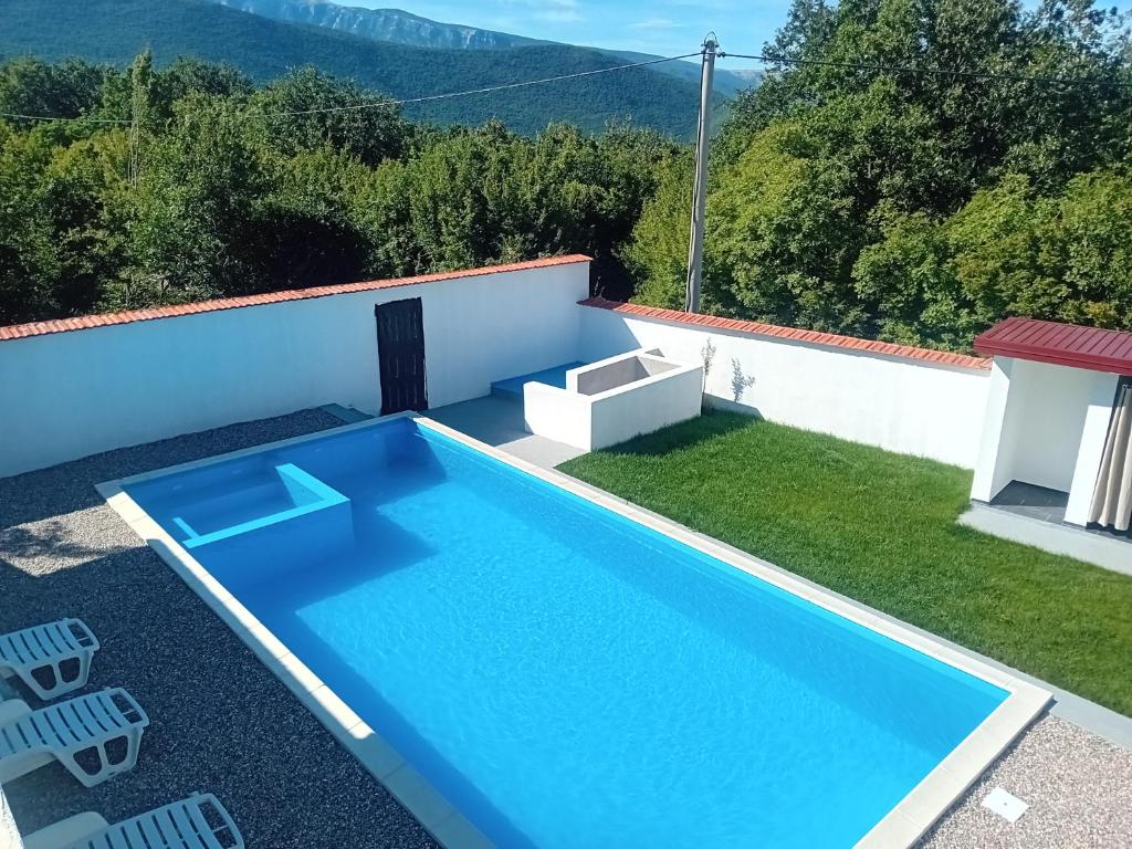 a swimming pool on the roof of a house at Villa Green in Mostar