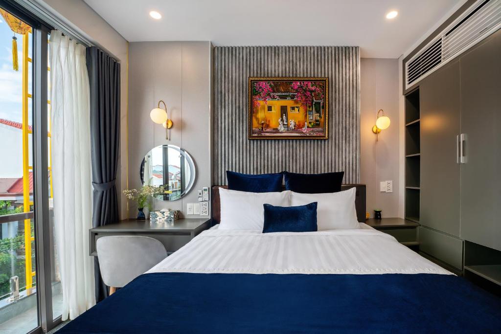Postel nebo postele na pokoji v ubytování Hannah House Hoi An