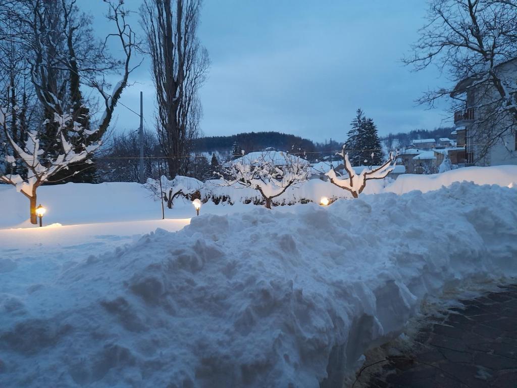 a pile of snow in a yard at night at Gabriella in SantʼEufemia a Maiella