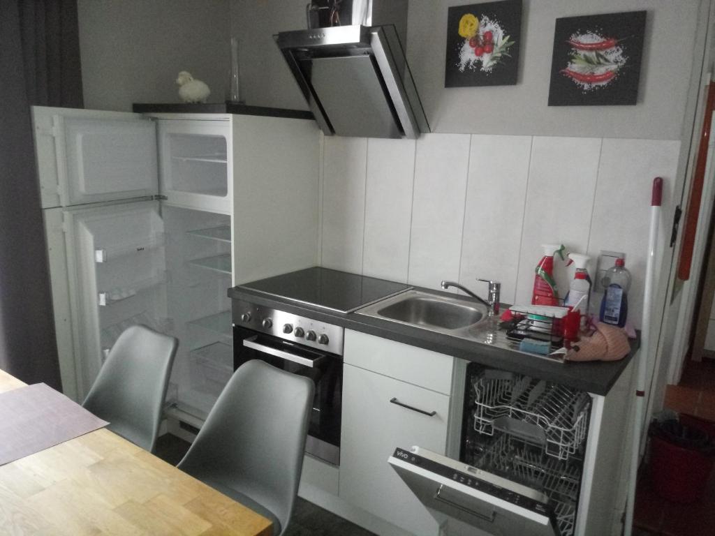 a small kitchen with a sink and a stove at Oppidum Brilon in Brilon
