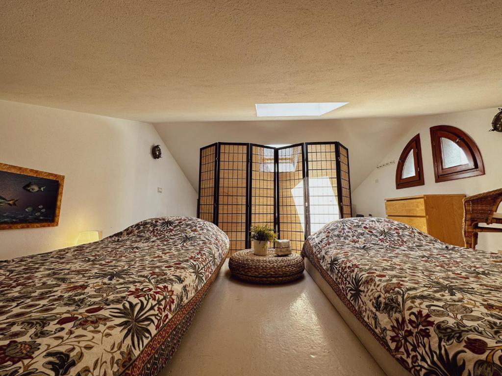 Postel nebo postele na pokoji v ubytování Casa Rais Dragut