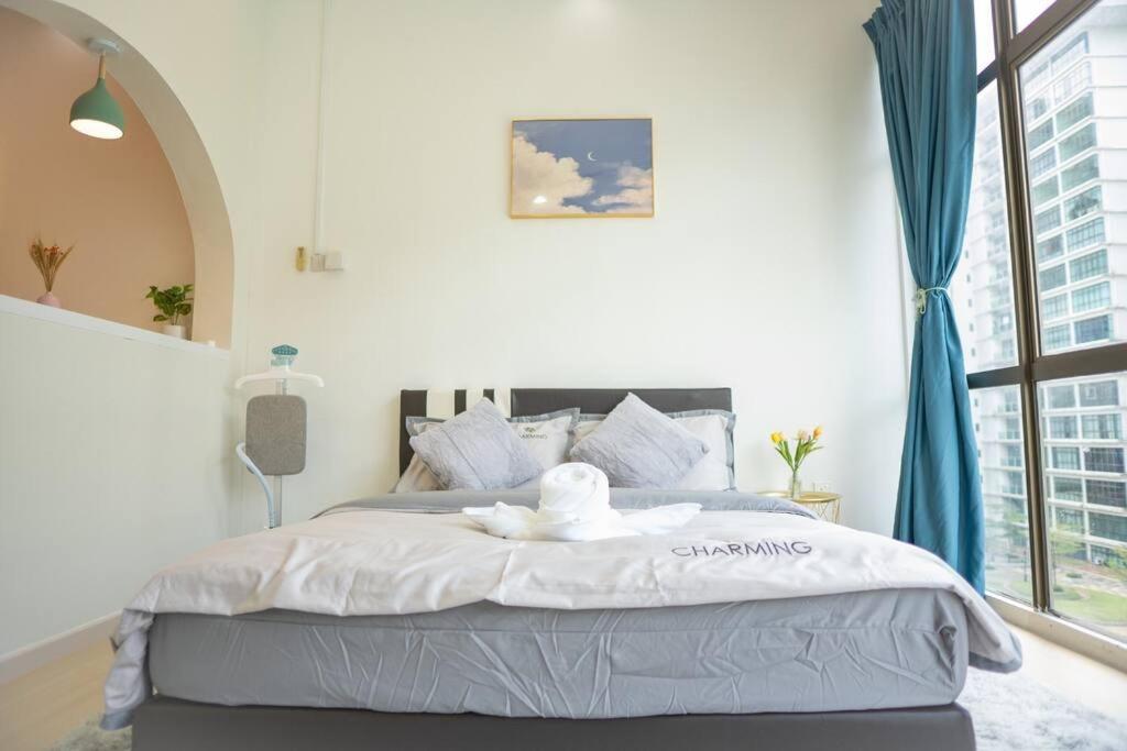 a bedroom with a white bed with a large window at Mount Austin #Palazio B1 Studio Modern Cozy 1-2Pax #MSPro in Johor Bahru