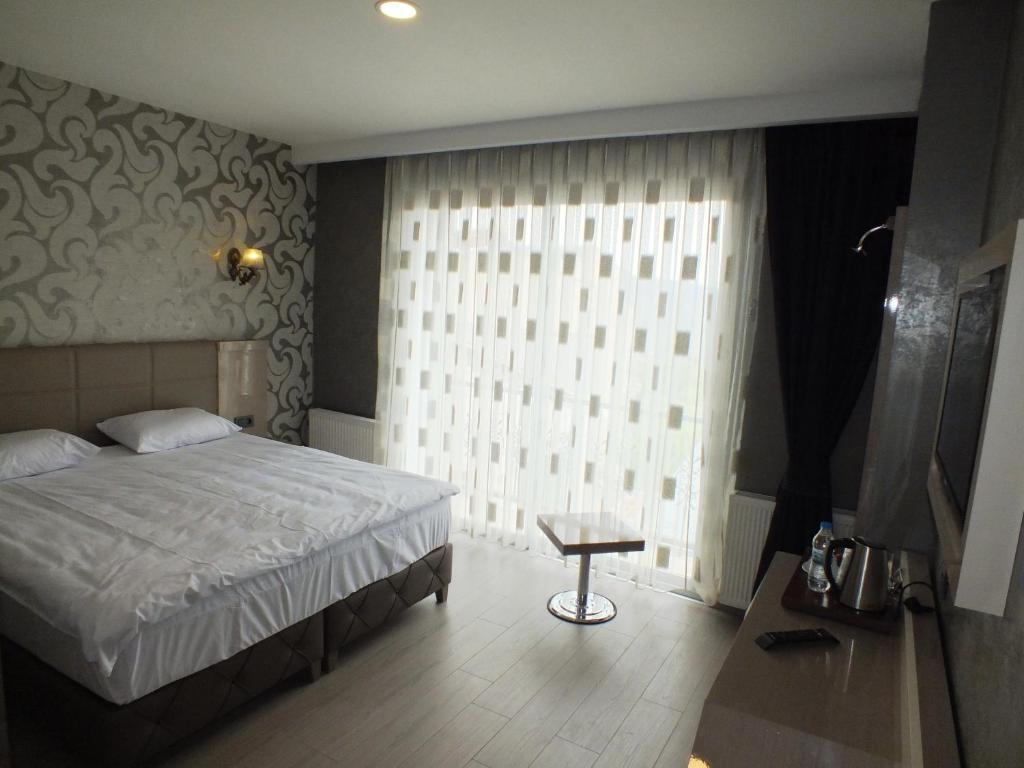 Postel nebo postele na pokoji v ubytování Colonia Park Otel