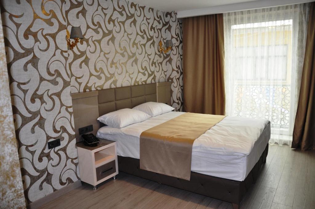 Postel nebo postele na pokoji v ubytování Colonia Park Otel