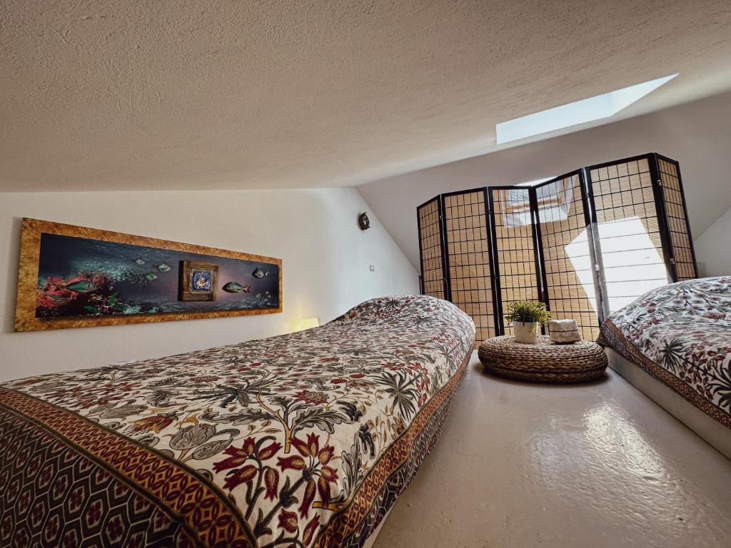 Postel nebo postele na pokoji v ubytování Casa Rais Dragut