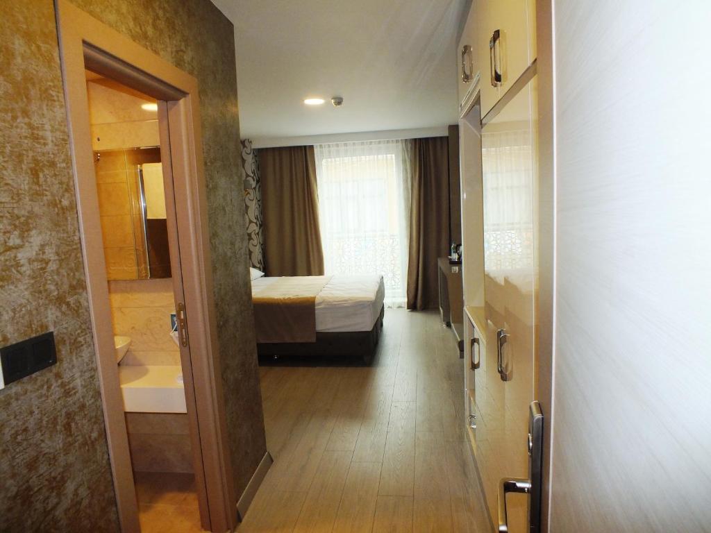 Postel nebo postele na pokoji v ubytování Colonia Park Otel