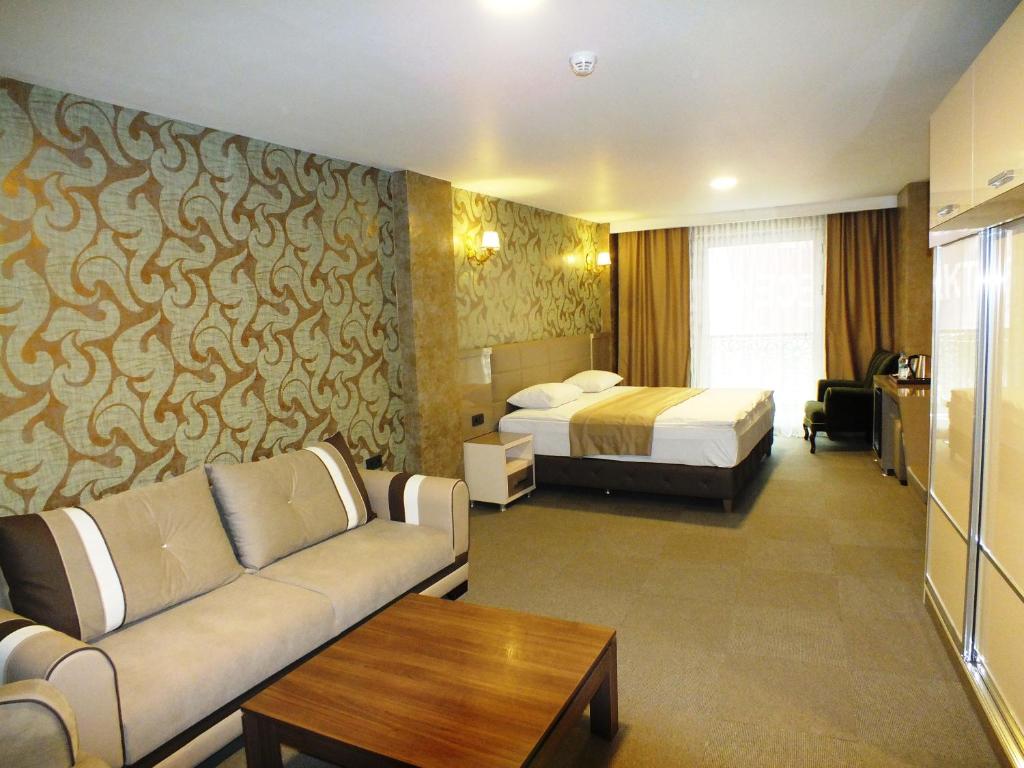 Postel nebo postele na pokoji v ubytování Colonia Park Otel