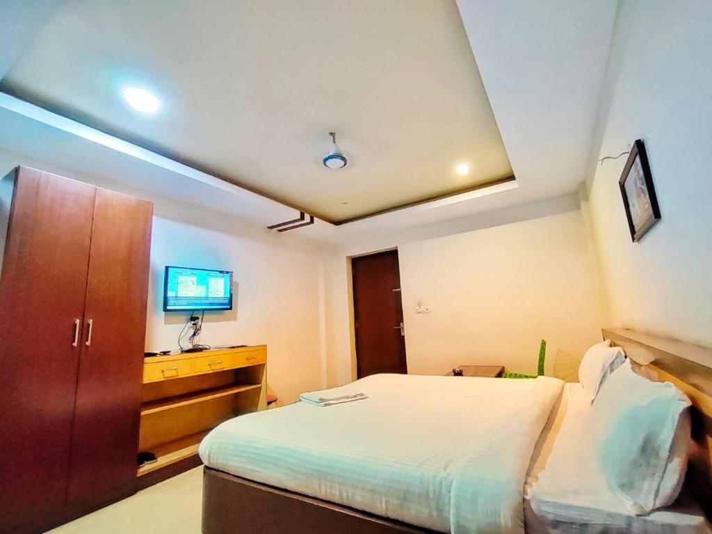 Postel nebo postele na pokoji v ubytování Hotel Jasmin Palace