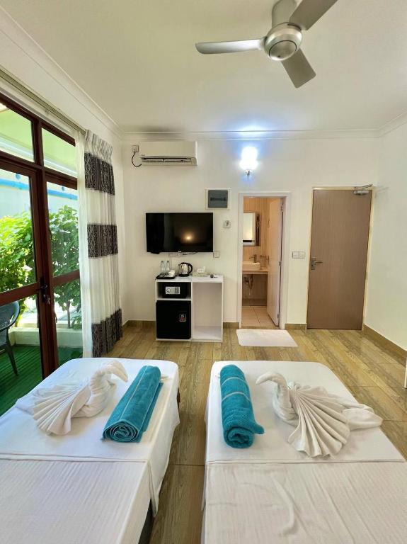 Postel nebo postele na pokoji v ubytování Balma Beach Inn