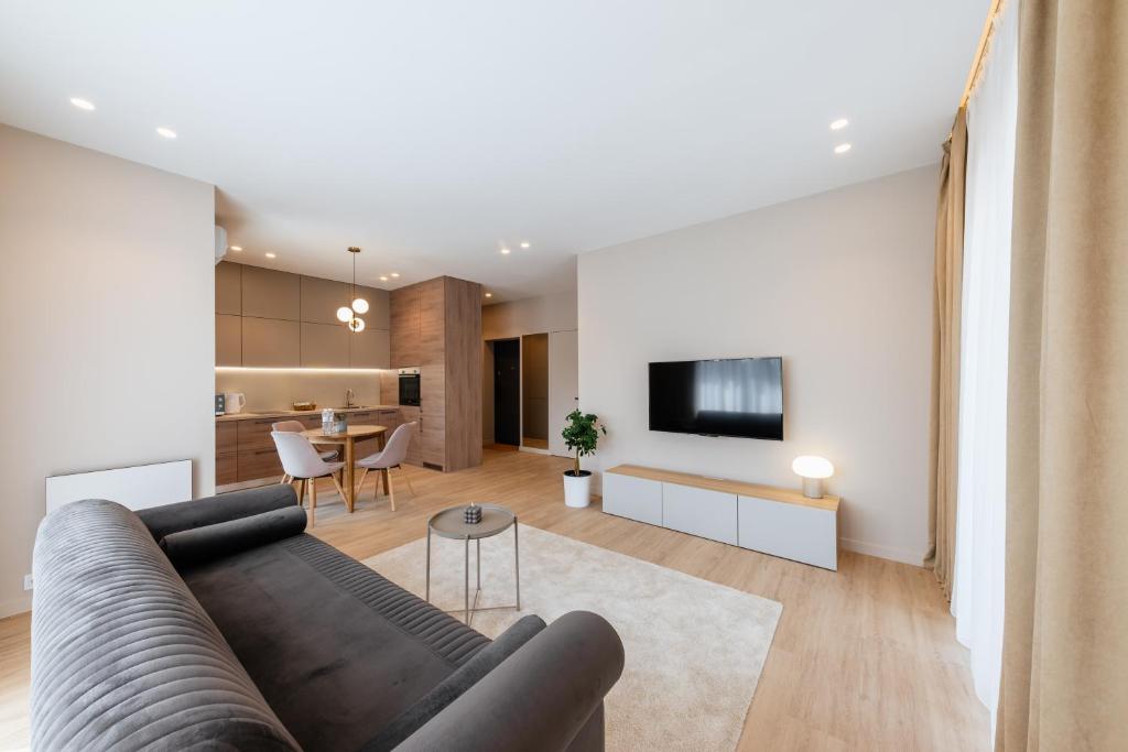 TV a/nebo společenská místnost v ubytování ММ GROUP APARTMENT