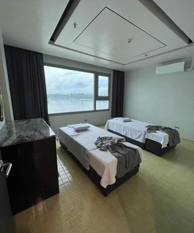Postel nebo postele na pokoji v ubytování Cube9 Resort & Spa 큐브9 리조트 & 스파