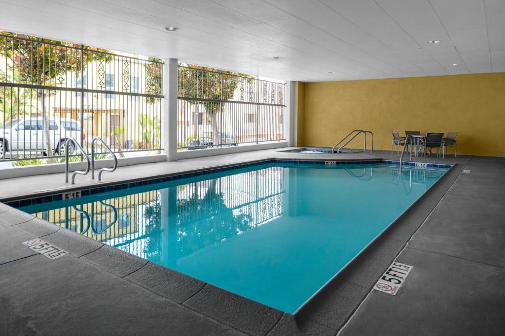a large swimming pool in a hotel room at Holiday Inn Express Hotel & Suites Hermosa Beach, an IHG Hotel in Hermosa Beach