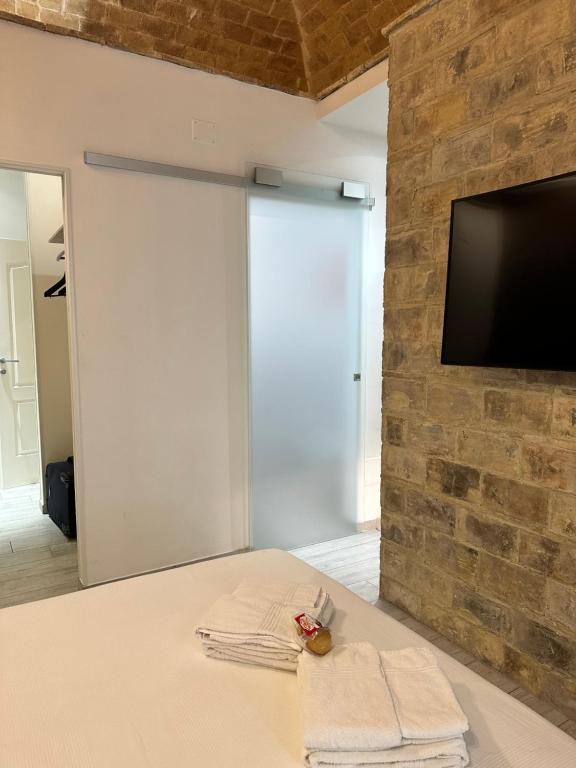 Telewizja i/lub zestaw kina domowego w obiekcie B & B Via Cavour