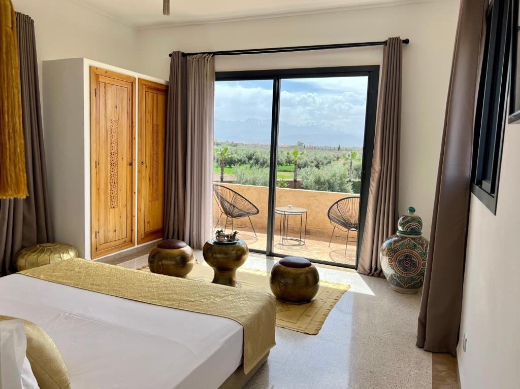 Postel nebo postele na pokoji v ubytování LE JASMIN DE MARRAKECH