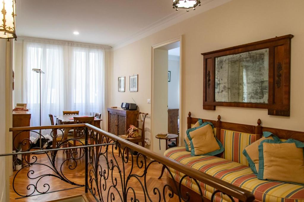 a living room with a couch on a balcony at Cianis Home San Marco - Apartment in Venice