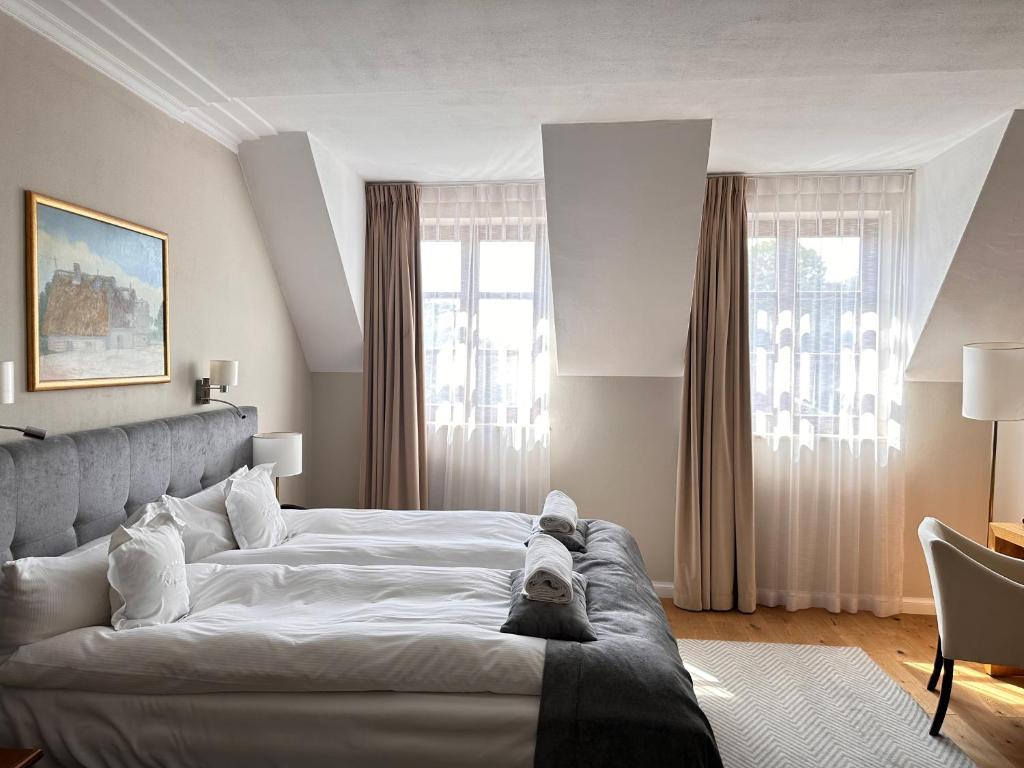 Posteľ alebo postele v izbe v ubytovaní Hotel Rubinstein