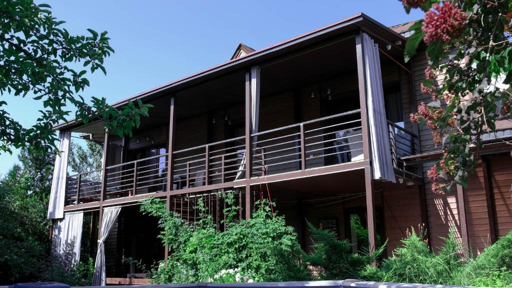 an external view of a building with a balcony at Svezhest/Свежесть in Kok-Shoky