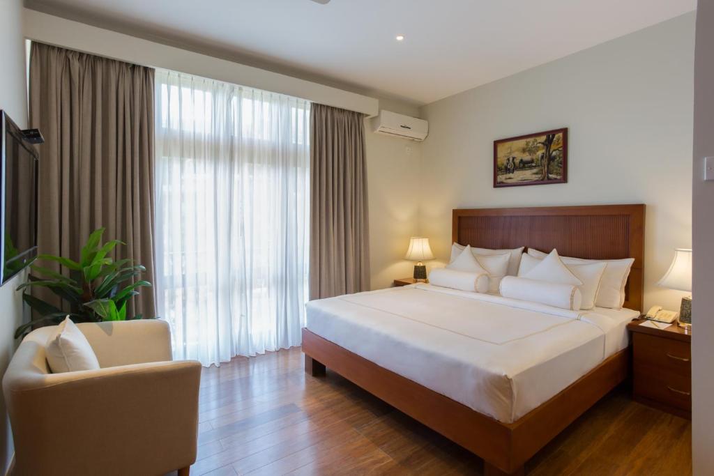 Postel nebo postele na pokoji v ubytování Serene Villa 38