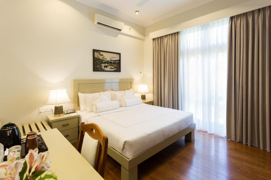 Postel nebo postele na pokoji v ubytování Serene Villa 38