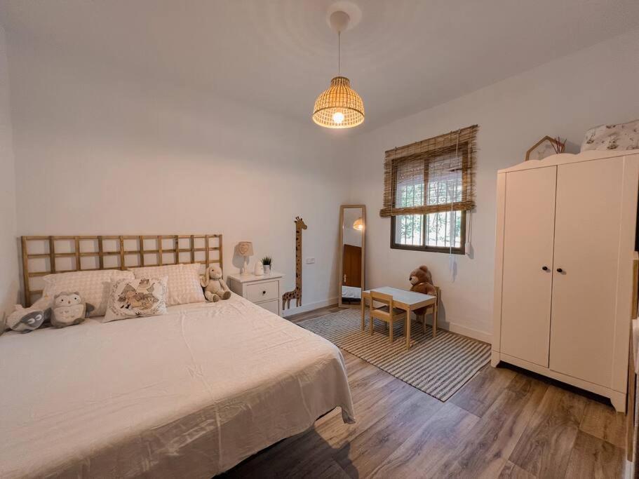Postel nebo postele na pokoji v ubytování Villa Jopito Alcaucín