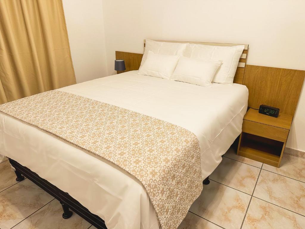 Postel nebo postele na pokoji v ubytování Helechos Hotel