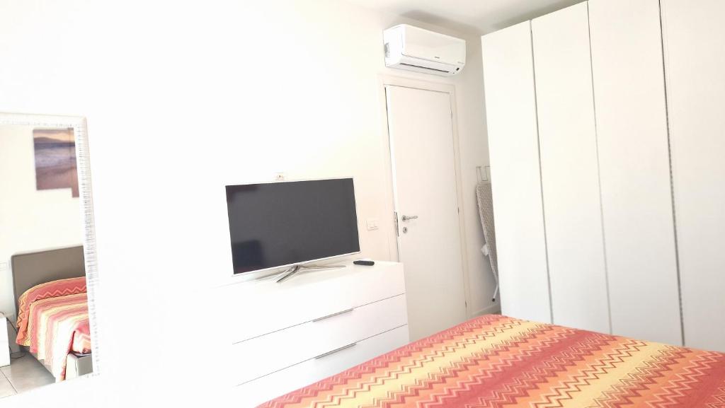 Telewizja i/lub zestaw kina domowego w obiekcie Appartamento 2 il Vigneto