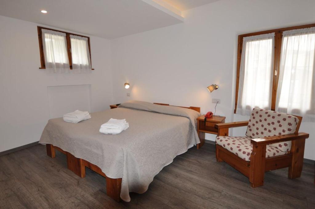 Postel nebo postele na pokoji v ubytování Meublé Albergo Dante
