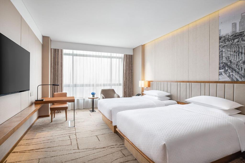 Postel nebo postele na pokoji v ubytování Four Points by Sheraton Shanghai, Kangqiao