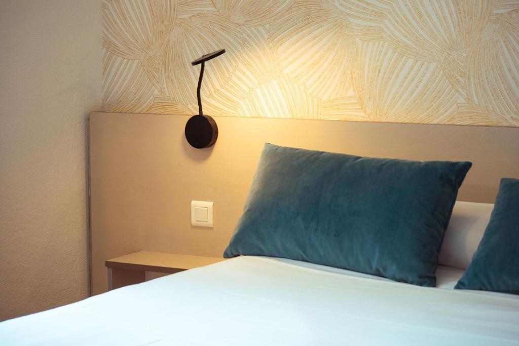 Postel nebo postele na pokoji v ubytování Grand Hôtel du Parc