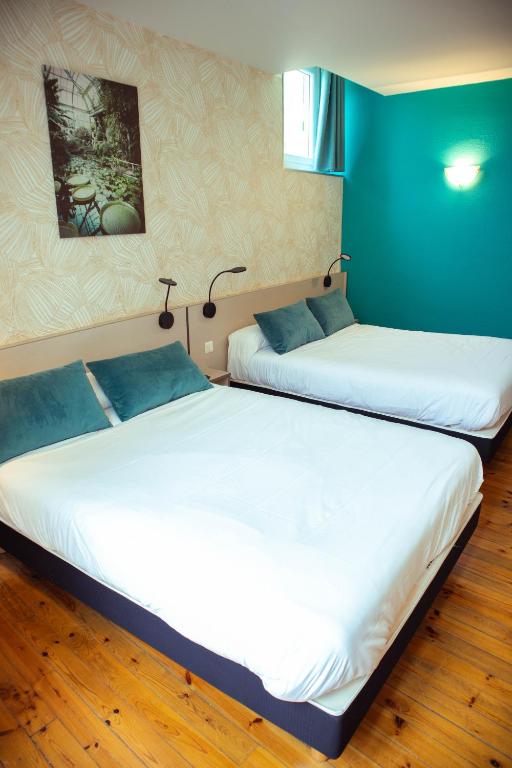 Postel nebo postele na pokoji v ubytování Grand Hôtel du Parc