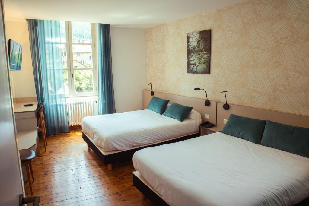 Postel nebo postele na pokoji v ubytování Grand Hôtel du Parc