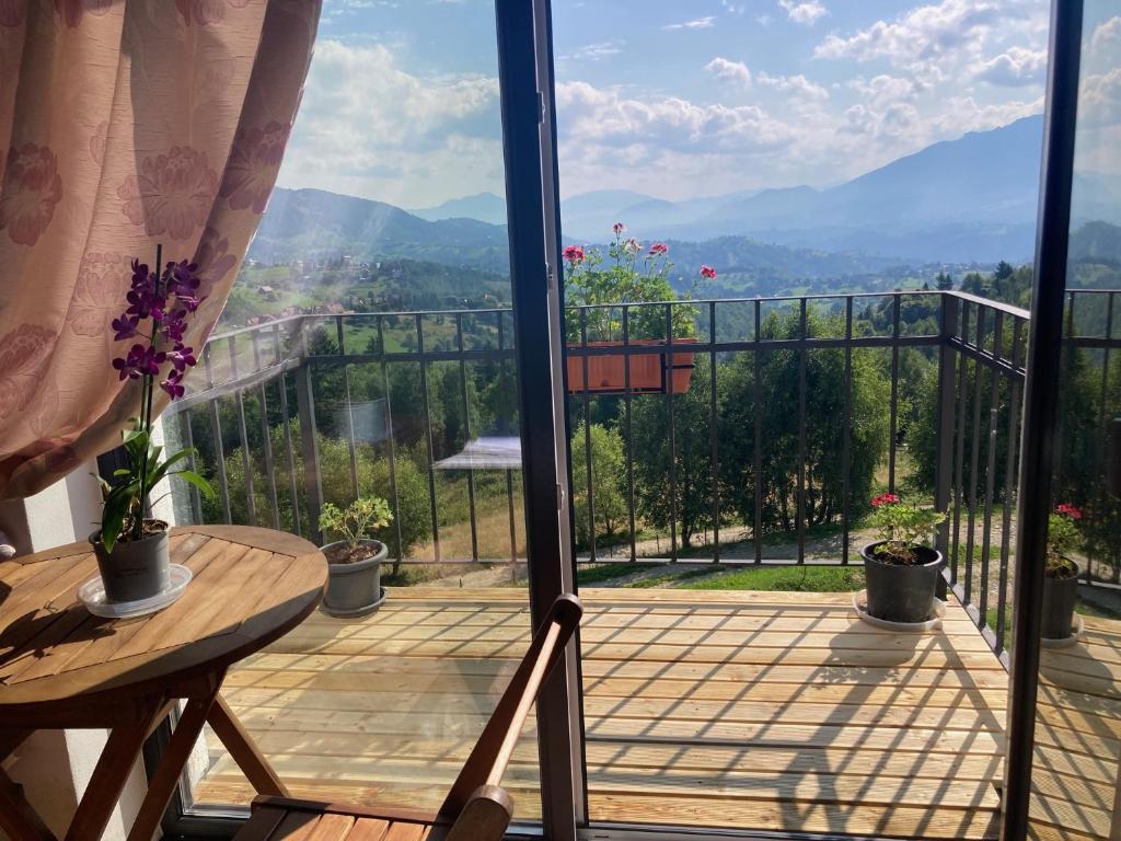 a balcony with a view of the mountains at The Mountain View - no children in Peştera