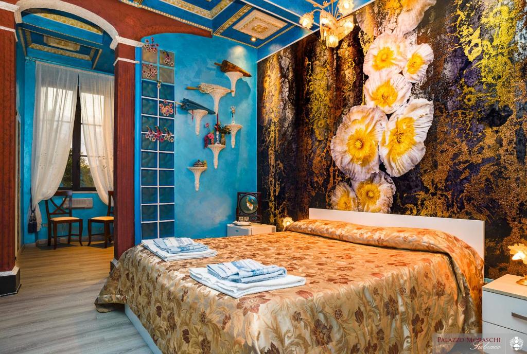 A bed or beds in a room at Palazzo Moraschi Subiaco
