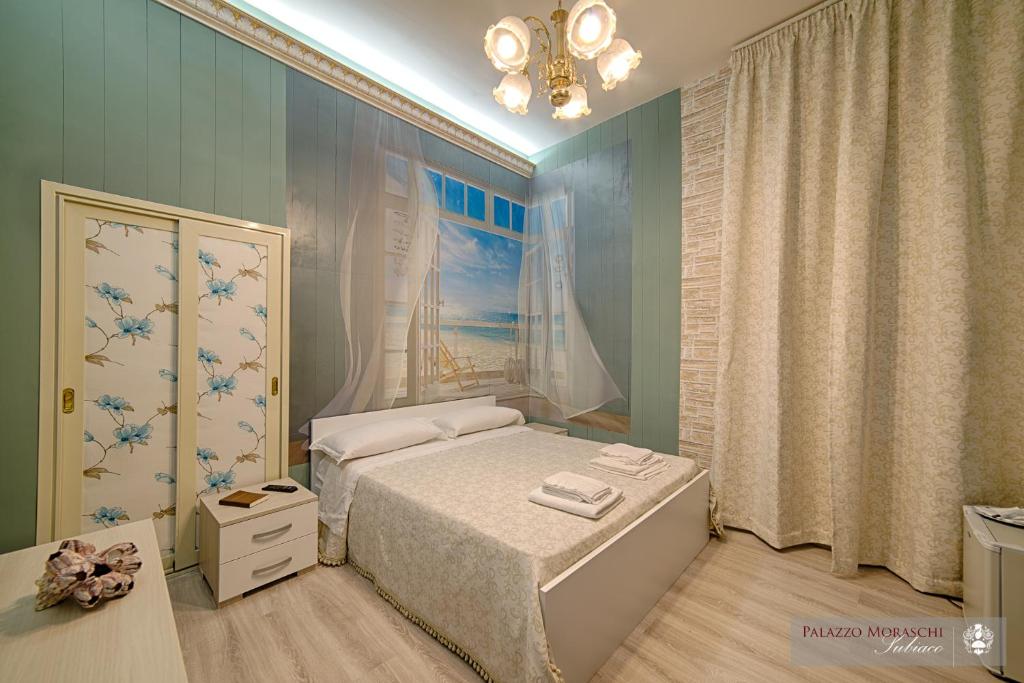 A bed or beds in a room at Palazzo Moraschi Subiaco