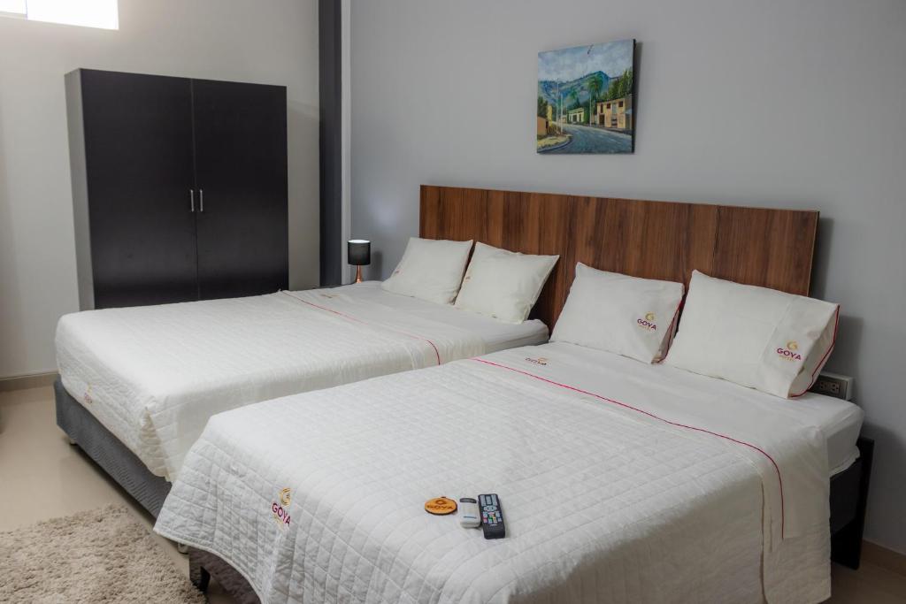 Postel nebo postele na pokoji v ubytování GOYA HOTEL