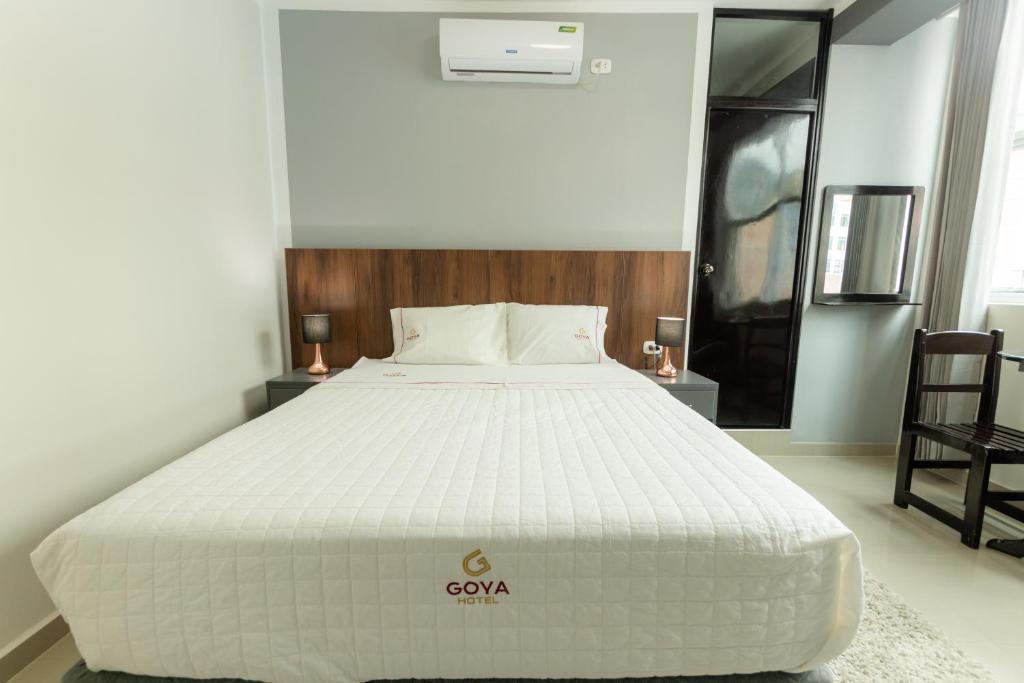 Postel nebo postele na pokoji v ubytování GOYA HOTEL