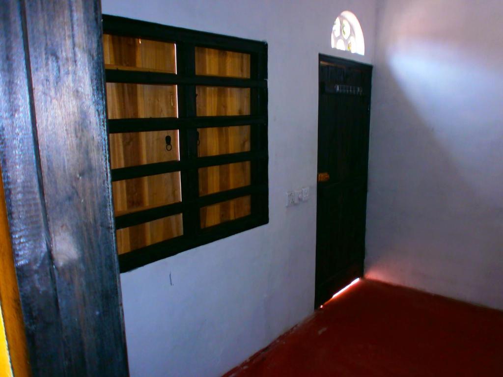 Postel nebo postele na pokoji v ubytování 20 House Arugam