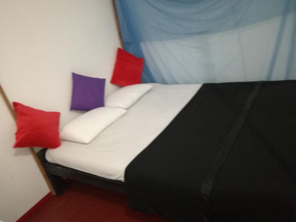 Postel nebo postele na pokoji v ubytování 20 House Arugam