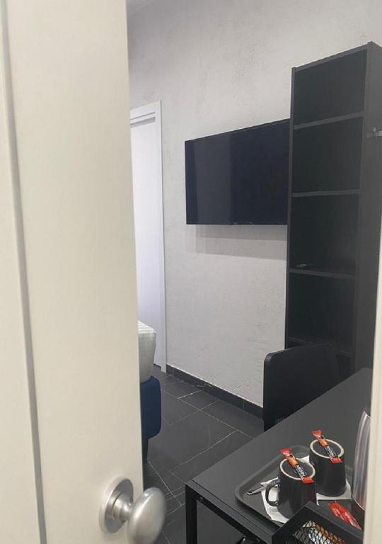 TV a/nebo společenská místnost v ubytování Le Colonne B&b