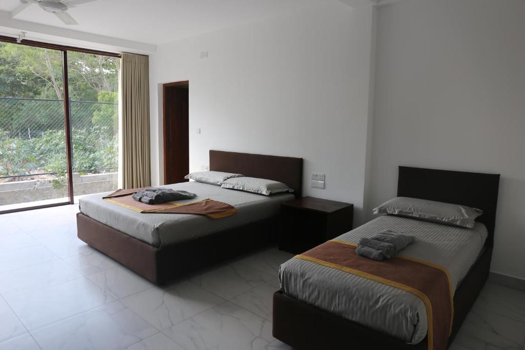Postel nebo postele na pokoji v ubytování Amanda Beach Resort