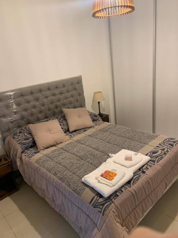 Ένα ή περισσότερα κρεβάτια σε δωμάτιο στο Departamento de categoria con piscina, cochera opcional y seguridad 24hs