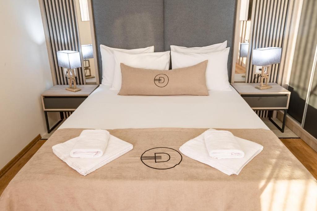 Postel nebo postele na pokoji v ubytování Dulamerovic Hotel