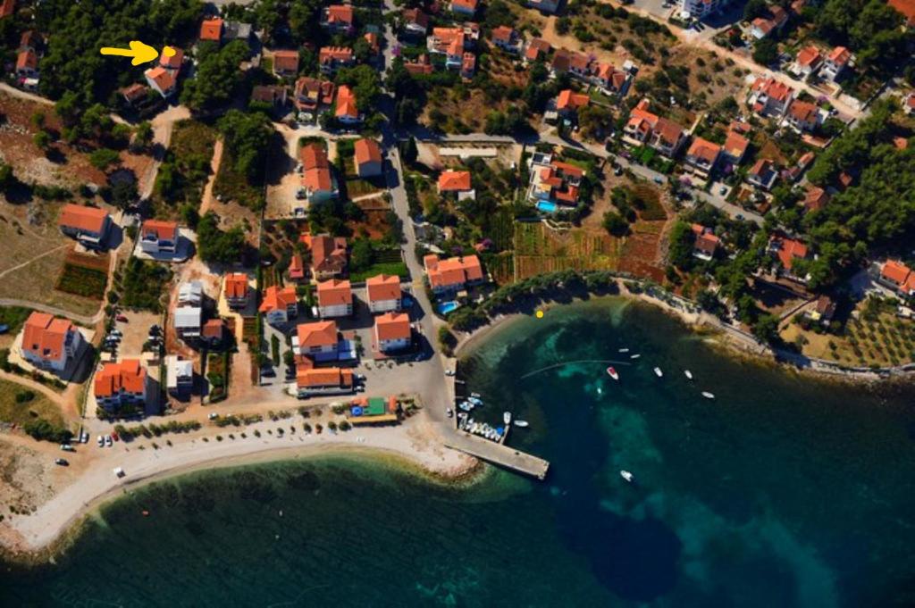 an aerial view of a beach with houses and the water at HOUSE-APARTMENTS ELA -MIRCA- FAMILY HOLIDAY in Mirce