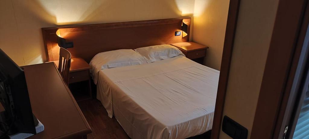Postel nebo postele na pokoji v ubytování Hotel Dimora Adriana