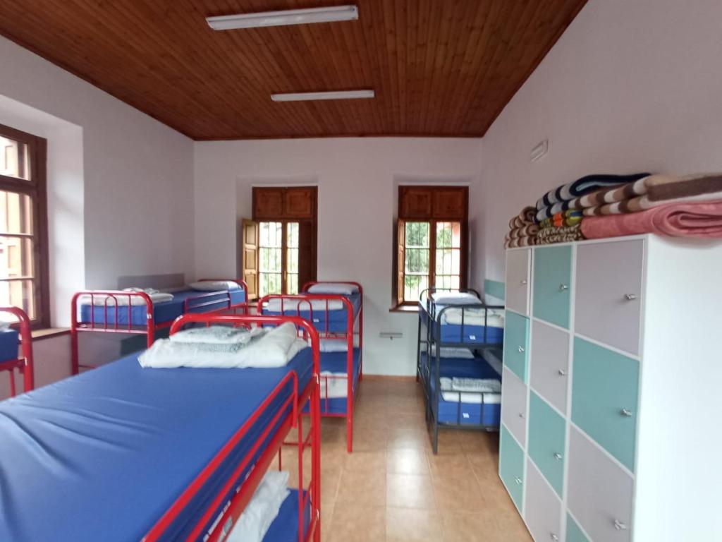Postel nebo postele na pokoji v ubytování Alojamiento covadonga